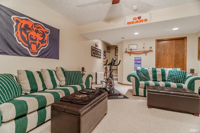 living room with a textured ceiling and carpet