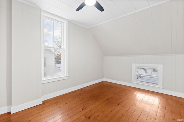 additional living space featuring lofted ceiling, wood-type flooring, and ceiling fan