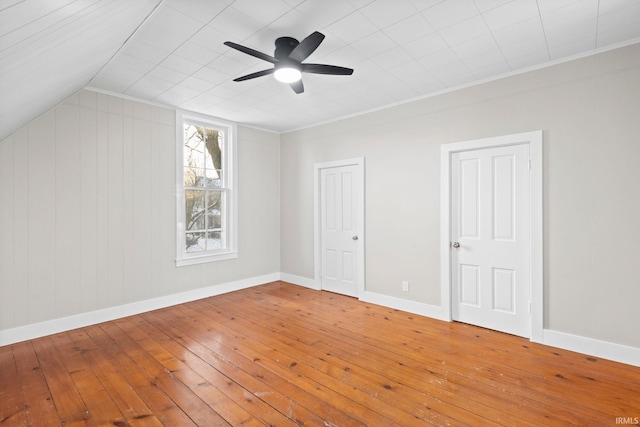 bonus room with ceiling fan and hardwood / wood-style flooring