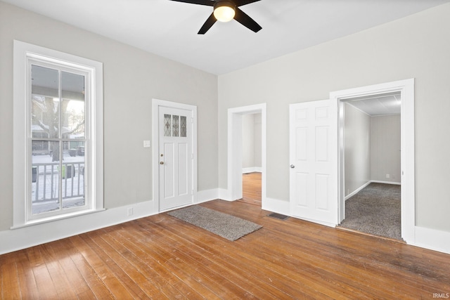 entryway with ceiling fan and wood-type flooring