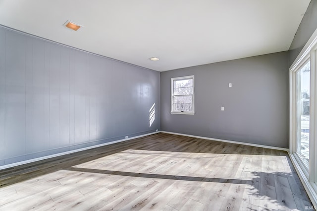 empty room with light hardwood / wood-style floors