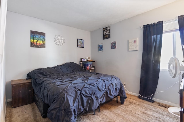 bedroom with light colored carpet