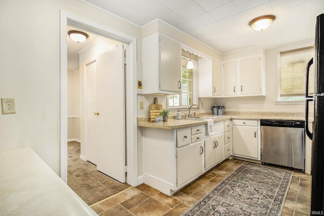 kitchen with white cabinets, stainless steel dishwasher, dark carpet, and sink