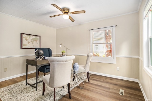 office space with hardwood / wood-style floors, ceiling fan, and ornamental molding