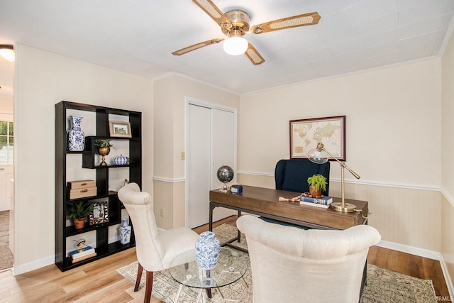 office area with crown molding, ceiling fan, and light hardwood / wood-style flooring