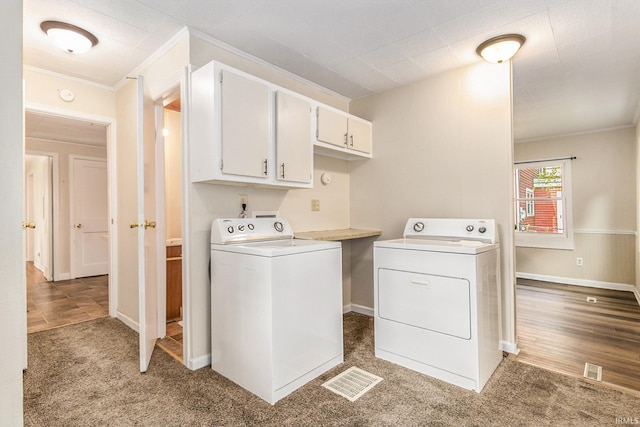 washroom featuring cabinets, carpet floors, and independent washer and dryer