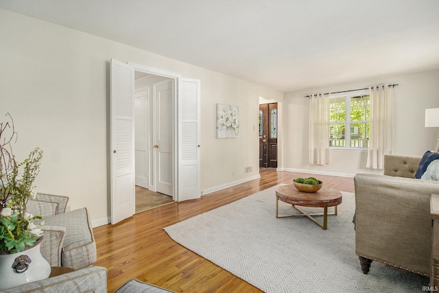 living room with light hardwood / wood-style floors