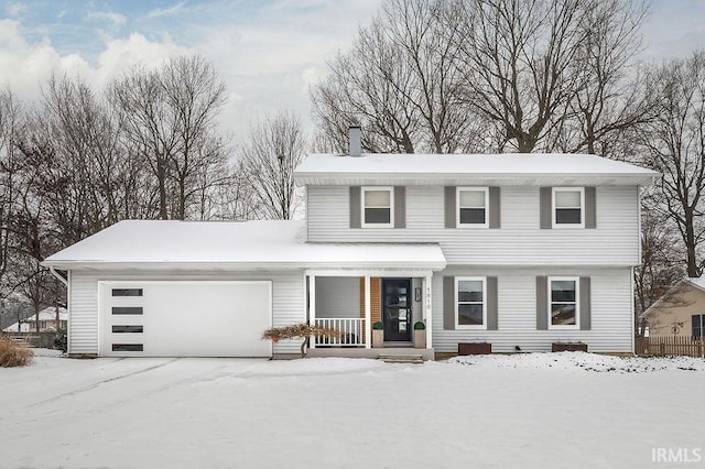 view of front of house featuring a porch and a garage