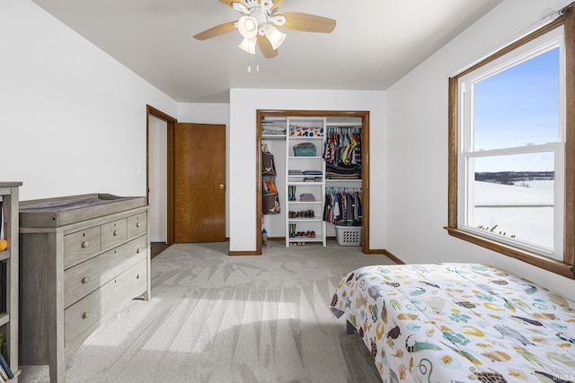 carpeted bedroom featuring ceiling fan