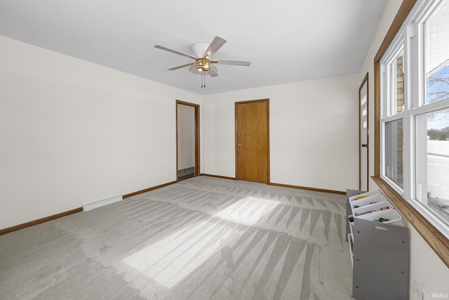 unfurnished room featuring ceiling fan and light colored carpet