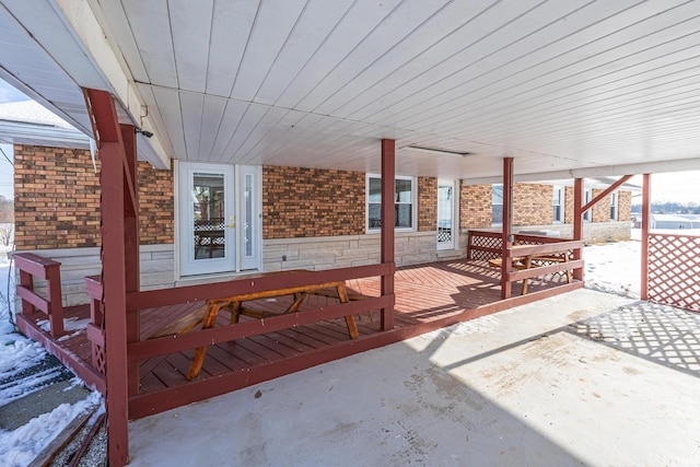 snow covered patio with covered porch