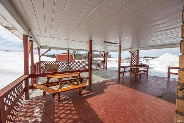 view of snow covered deck