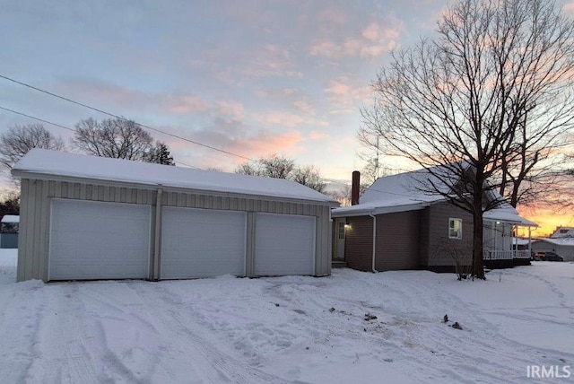 view of snow covered garage