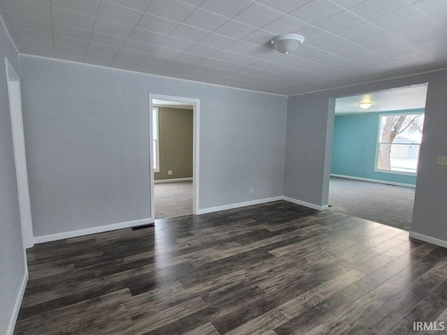 unfurnished room featuring dark hardwood / wood-style floors