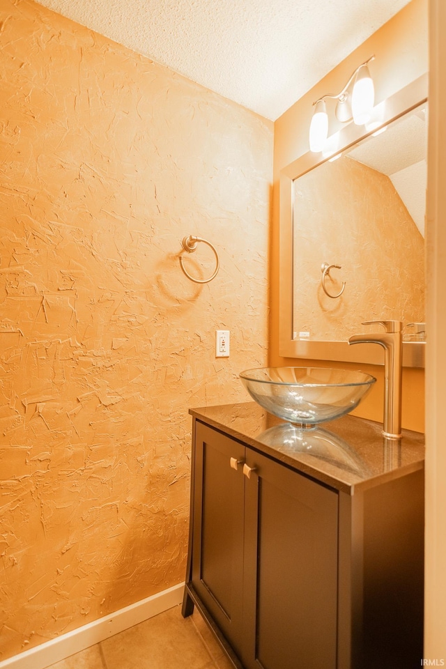 bathroom with vanity and tile patterned flooring