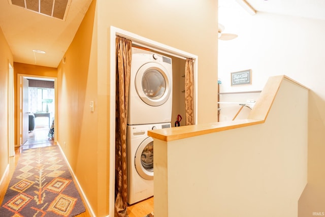 laundry room featuring stacked washer and clothes dryer