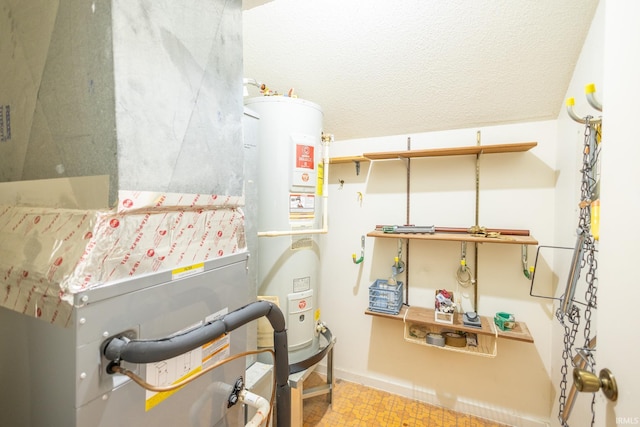 utility room featuring gas water heater