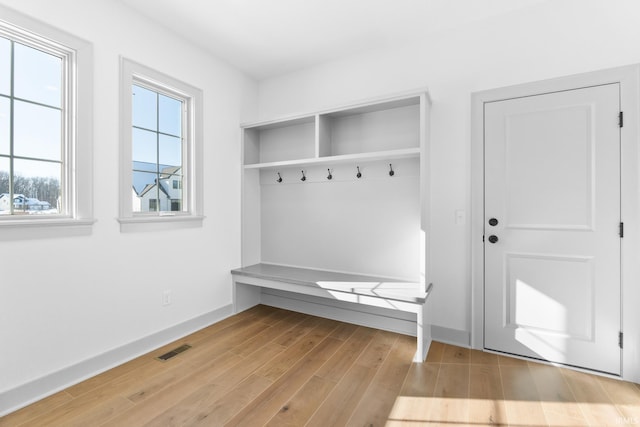 mudroom with light hardwood / wood-style floors