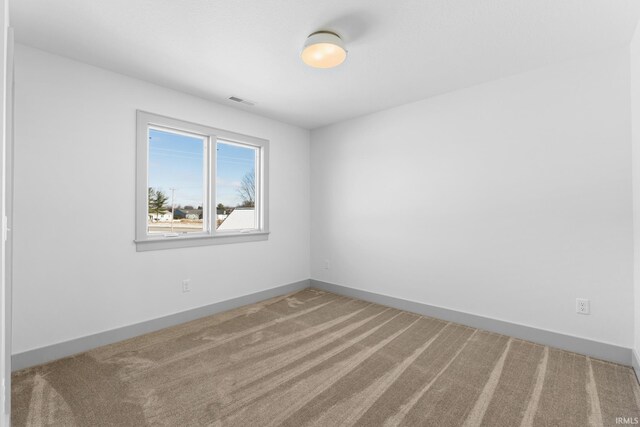 unfurnished room with carpet floors