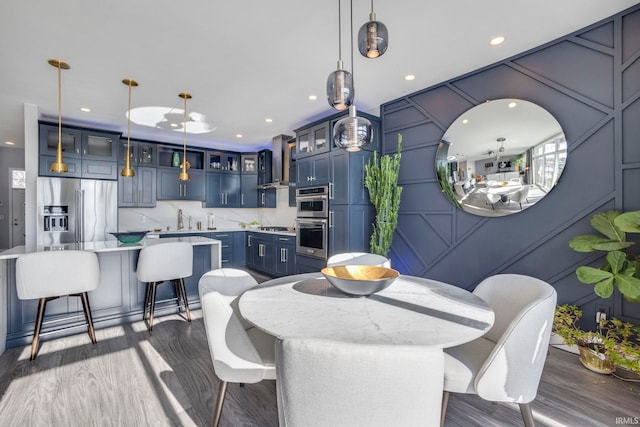 dining space with sink and dark hardwood / wood-style floors