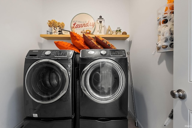 clothes washing area featuring washer and dryer