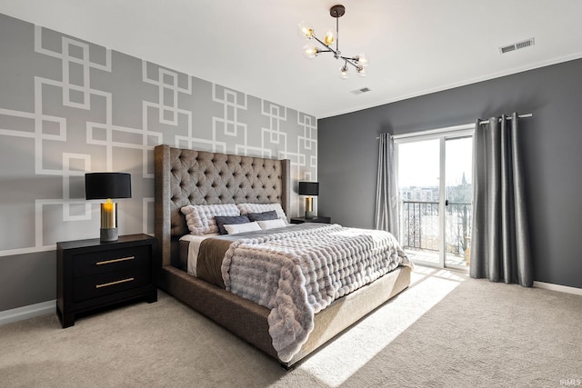 carpeted bedroom featuring a chandelier and access to exterior