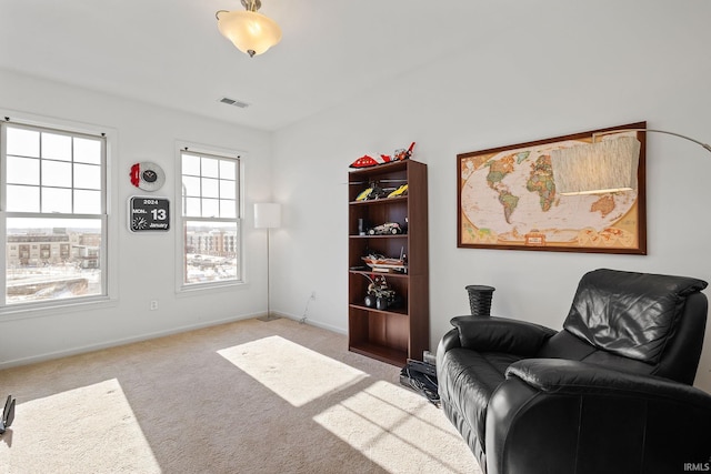 living area with light colored carpet