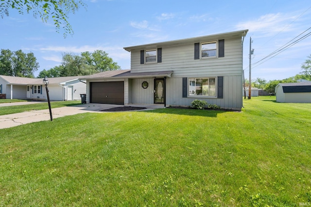 view of property with a front lawn and a garage