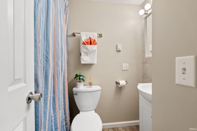 bathroom featuring toilet and vanity