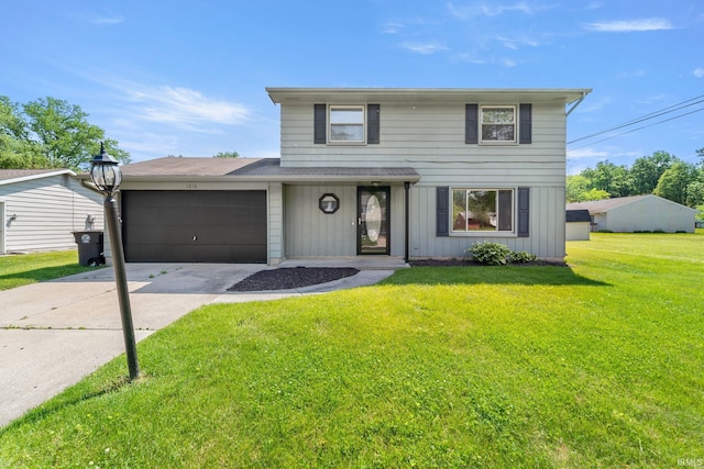 view of front property featuring a garage and a front lawn