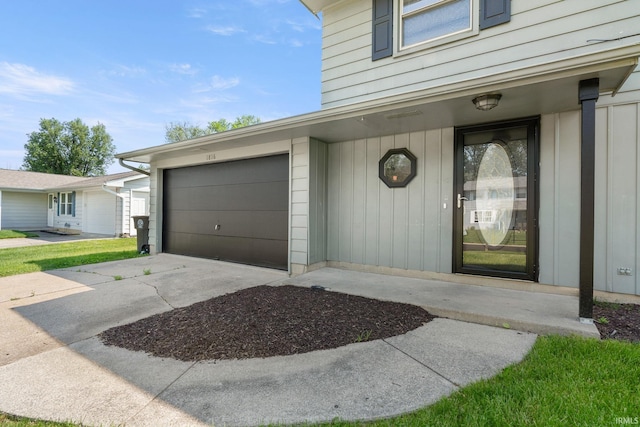 doorway to property with a garage