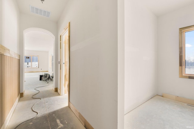 hallway featuring plenty of natural light