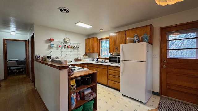 kitchen featuring sink and white appliances