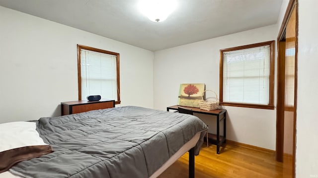 bedroom with hardwood / wood-style flooring