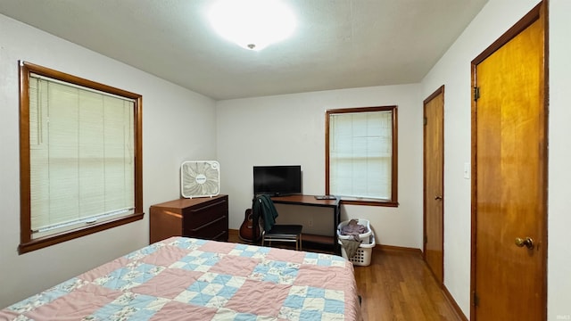 bedroom with light hardwood / wood-style flooring