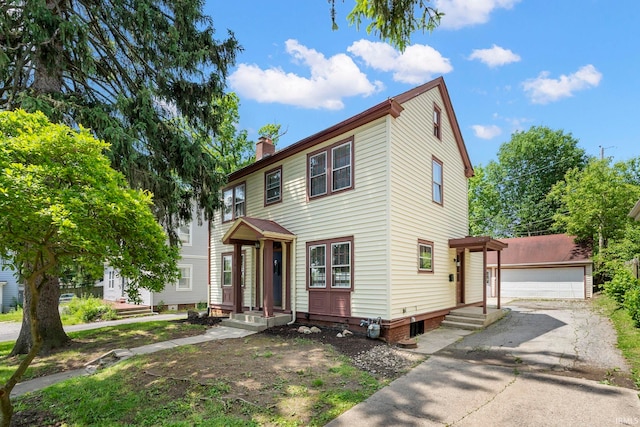 view of front of home featuring a garage and an outdoor structure