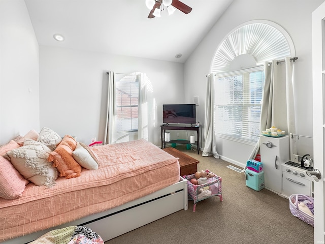 bedroom with lofted ceiling, ceiling fan, carpet flooring, visible vents, and baseboards