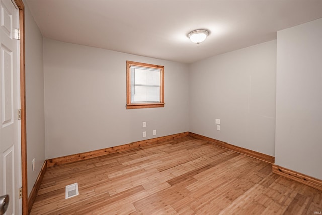 spare room featuring light hardwood / wood-style flooring