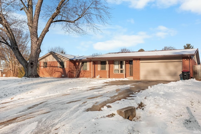 single story home with a garage