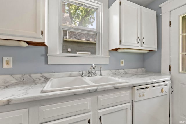 kitchen with white cabinets, dishwasher, light stone counters, and sink