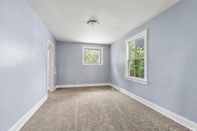 unfurnished room featuring carpet floors