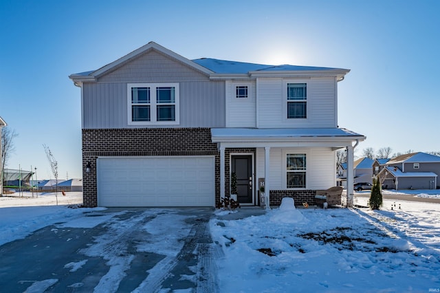 front of property with covered porch and a garage