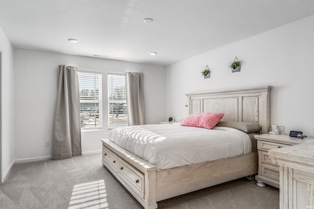 bedroom with light carpet