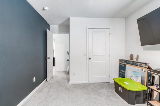 interior space featuring light colored carpet