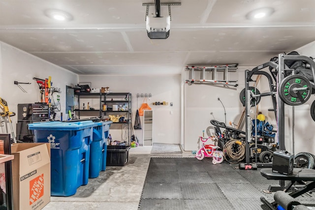 garage featuring electric panel and a garage door opener