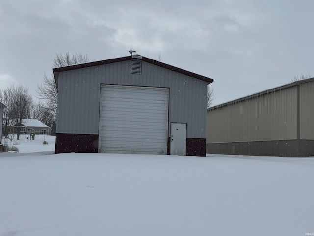 view of snow covered garage