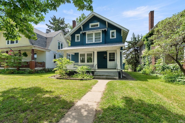 view of front facade with a porch and a front lawn