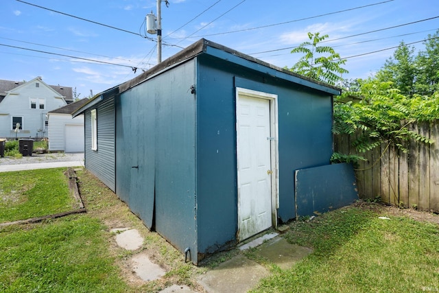 view of outbuilding with a lawn