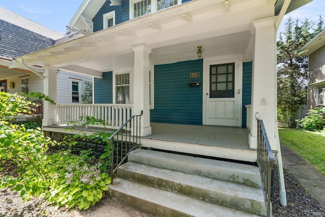 property entrance with covered porch