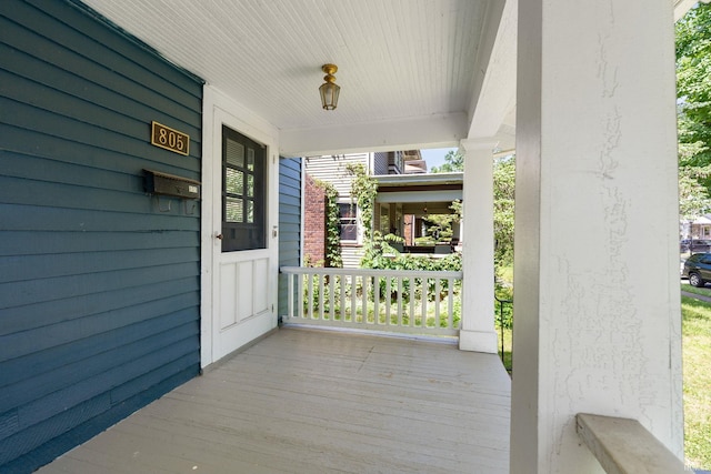 wooden terrace with a porch